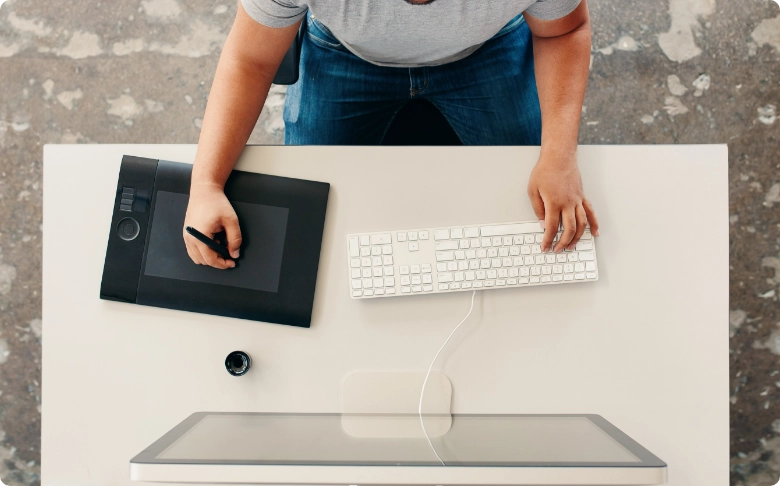 Graphic designer working at a desk