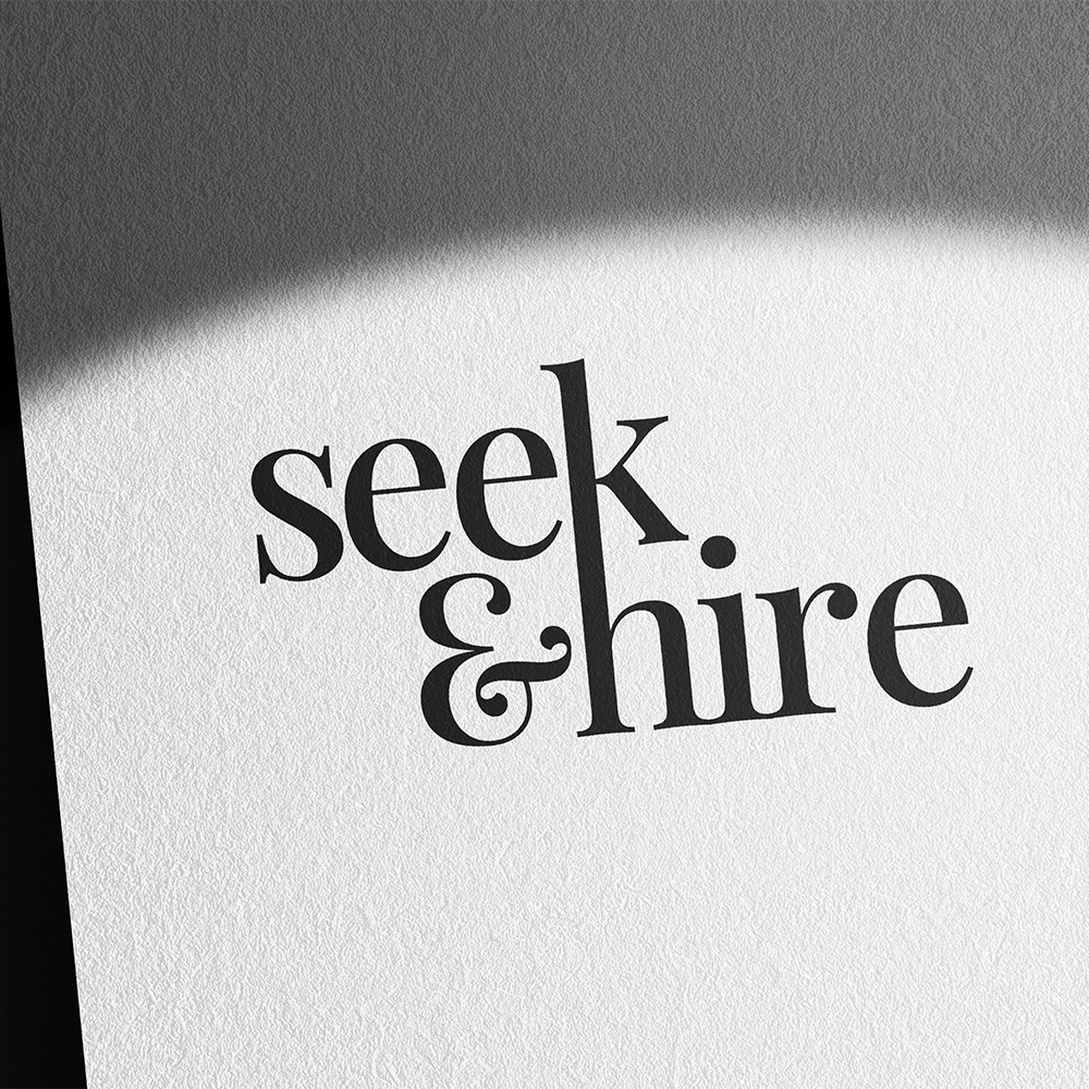 Mockup of the Seek & Hire logo on textured paper