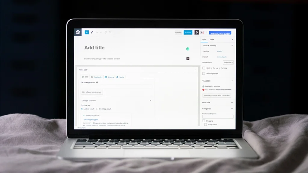 WordPress add a new post screen, with a laptop on the bed