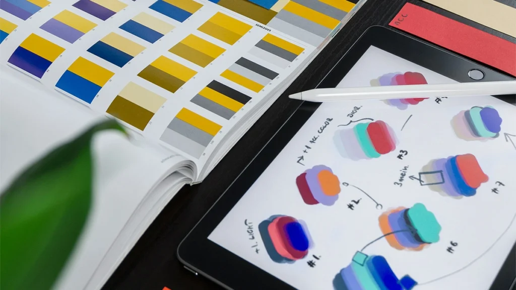 Colour swatches in a book and on a tablet