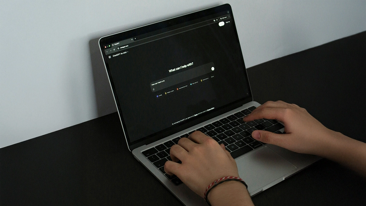 Person using ChatGPT on laptop