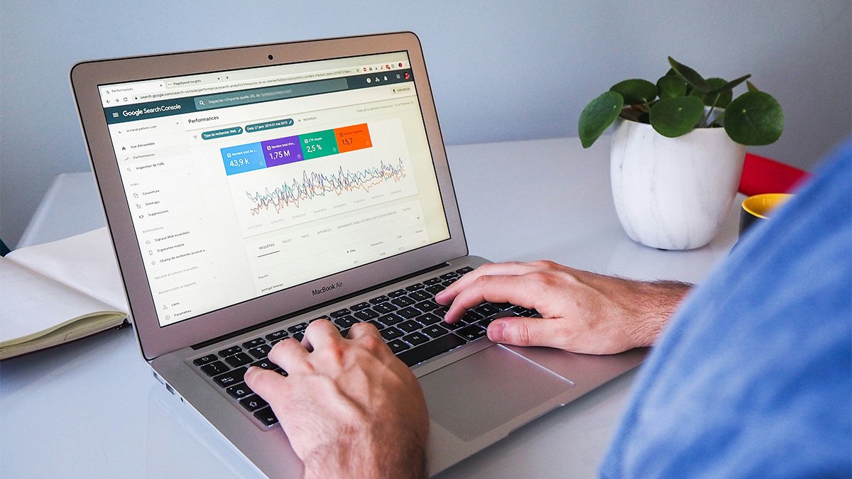 Man looking at Google Search Console dashboard on laptop