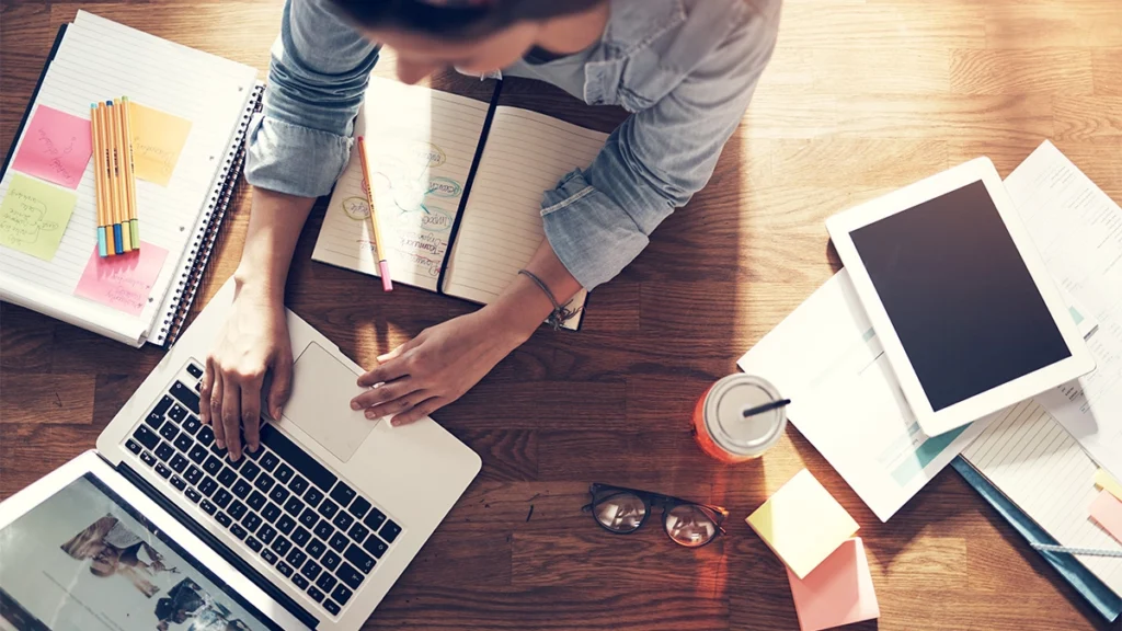 Businesswoman working and typing laptop in office