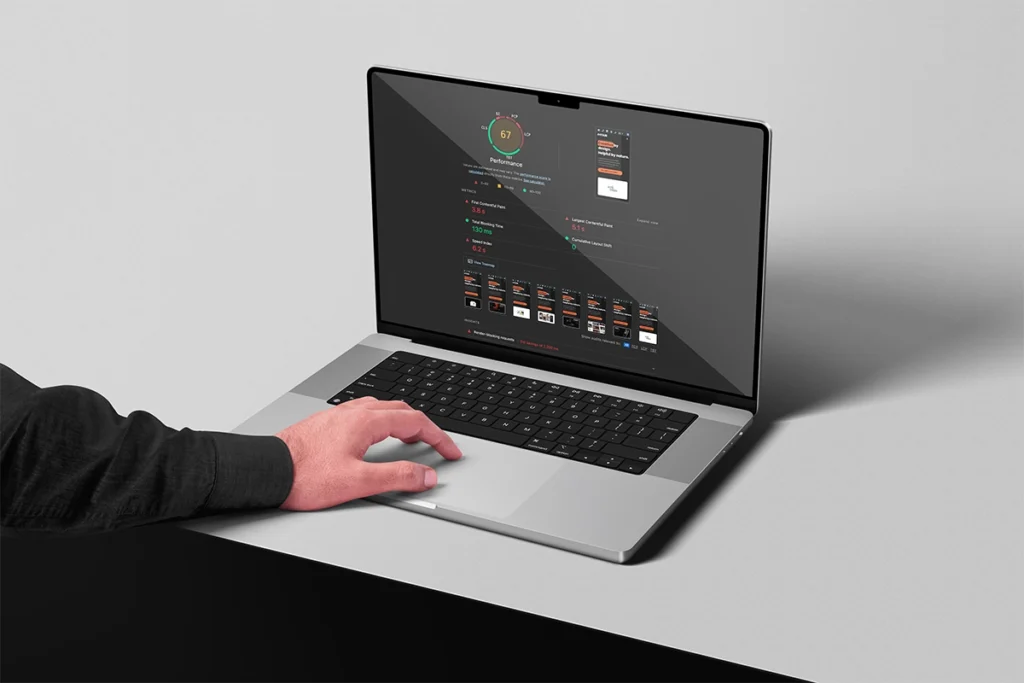 Man looking at a website audit report on a laptop