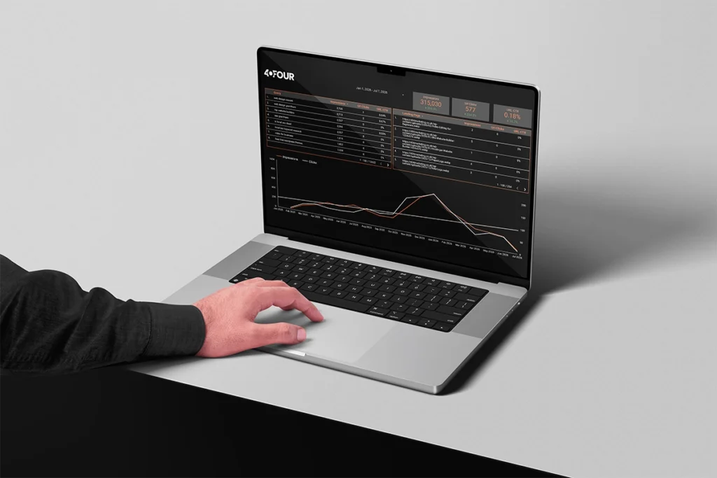 Man looking at website reporting dashboard on laptop