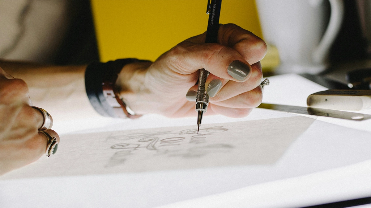 Designer sketching a logo refresh