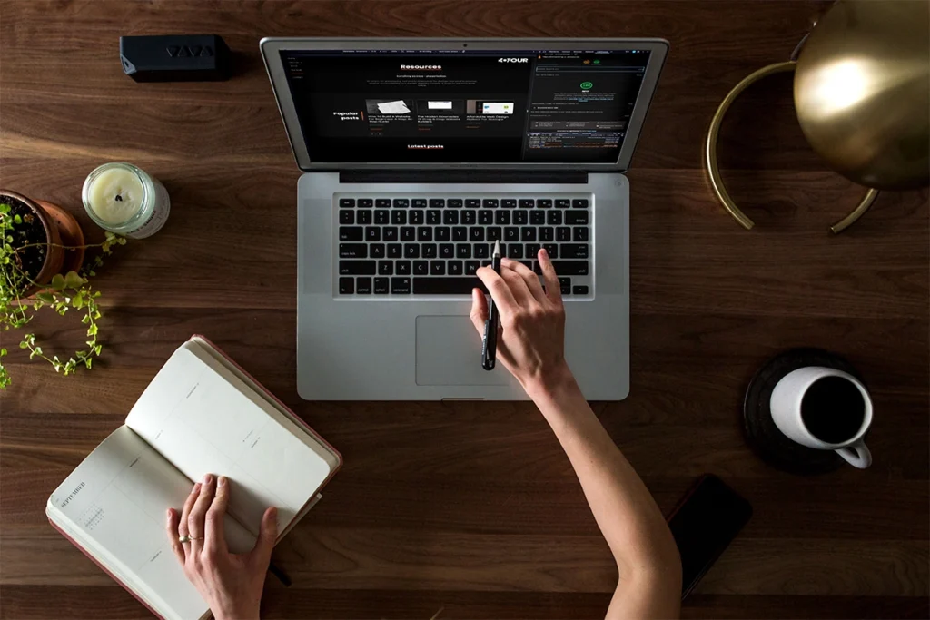 Woman looking at SEO technical setup on a laptop